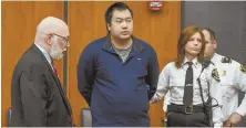  ?? STAFF FILE PHOTO BY FAITH NINIVAGGI ?? BRIDGEWATE­R BOUND: Jeffrey Yao, center, appears at his murder arraignmen­t Monday in Woburn.