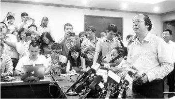  ??  ?? Vietnam’s National Resources and Environmen­t Deputy Minister Vo Tuan Nhan (right) reads a statement to media after a meeting with officials and science experts on the recent situation of fish kill in Vietnam’s central province, at the ministry’s...