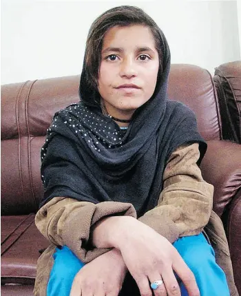  ?? ABDUL KHALIQ /THE ASSOCIATED PRESS ?? An Afghan girl known as Spozhmai, being held in protective custody in Lashkargah, capital of Helmand province, Afghanista­n, has asked President Hamid Karzai to find her a new home.