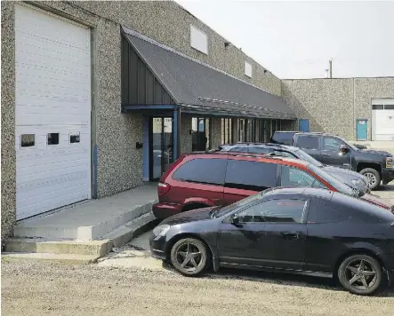  ?? LARRY WONG ?? Police have laid charges relating to an investigat­ion at the now-shuttered business Car Masters Collision Ltd. Parts found in the yard have been linked to 141 vehicles reported stolen across Alberta.