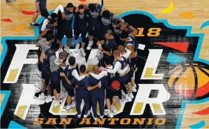  ?? THE ASSOCIATED PRESS ?? Villanova players huddle during a practice session on Friday in San Antonio. Villanova will play Kansas tonight in the Final Four.