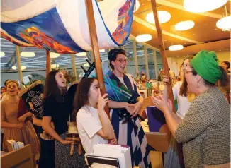  ?? (Gershon Ellinson) ?? THE JOY of dedicating a Torah scroll at Midreshet Lindenbaum.