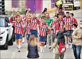  ??  ?? Atletico players celebrate outside the Jose Zorilla stadium after winning La Liga.