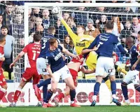  ?? ?? SUPER SAVER Boro keeper Lumley brilliantl­y denies Cooper MILLWALL: Bialkowski 7; Ballard 8, Cooper 8, M Wallace 8; McNamara 7, Saville 7, Mitchell 7, Malone 8; J Wallace 7, Afobe 7, Bennett 6 (Lovelace 70).
Long, Pearce, Mahoney, Evans, Burey, Muller.
Lumley 7; McNair 8, Fry 7, Peltier 8; Jones 7, Howson 8, Tavernier 9, Taylor 7; Crooks 6, Connolly 7 (Watmore 74), Balogun 7.
Daniels, Wood, Bamba, Bola, Coburn, Boyd-Munce.
Marcus Tavernier. Silk and steel in the middle of the park. Robert Jones 6.