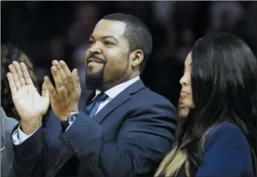  ?? KATHY WILLENS — THE ASSOCIATED PRESS FILE ?? Big3 Basketball League founder Ice Cube applauds the crowd during a timeout in the first half of Game 2 in the league’s debut at the Barclays Center in New York.