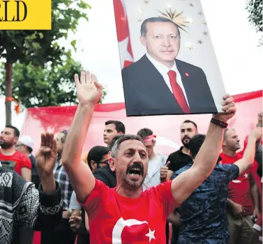  ?? JEFF J. MITCHELL / GETTY IMAGES ?? Supporters of Turkish President Recep Tayyip Erdogan celebrate outside AK party headquarte­rs in Istanbul, Sunday.