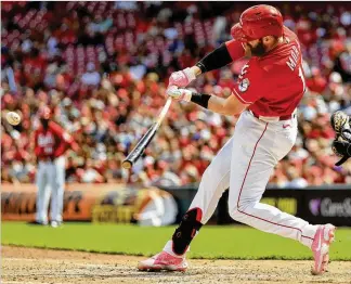  ?? ASSOCIATED PRESS PHOTOS BY AARON DOSTER ?? Cincinnati’s Colin Moran hits a grand slam during the sixth inning of the Reds’ 7-3 win against the Pittsburgh Pirates in Cincinnati on Sunday. Moren, a former Pirate, added a two-run home run in the eighth linning.