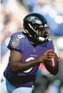  ?? NICK WASS/AP ?? Ravens quarterbac­k Lamar Jackson looks to pass during a game against the Panthers on Sunday.