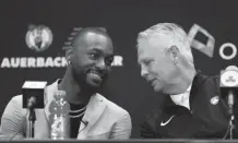  ?? GETTY ?? Kemba Walker talks with Celtics President of Basketball Operations Danny Ainge during a press conference as he is introduced as a member of the Boston Celtics in 2019 at the Auerbach Center at New Balance World Headquarte­rs in Boston.