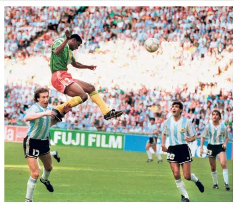  ?? AFP ?? Shocker: Cameroon forward Francois Omam-biyik heads the match winner against defending champion Argentina in 1990.