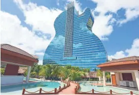  ?? SEMINOLE HARD ROCK HOTEL & CASINO ?? In addition to the 450-foot guitar hotel, the Hard Rock added the Oasis Tower, which houses 168 rooms and swim-up suites.