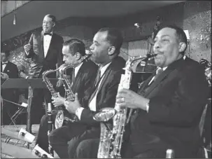  ?? The Associated Press ?? DUKE ELLINGTON: In this Jan. 21, 1967, file photo, band leader Duke Ellington, left, and his big band appear at Bal Pare, in Munich. Ellington was past 70 in 1967, but adventurou­s and creative as ever. His Grammy-winning album “Far East Suite” drew...