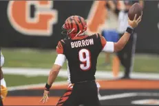  ?? ASSOCIATED PRESS ?? CINCINNATI BENGALS QUARTERBAC­K JOE BURROW (9) reacts after running for a touchdown during the first half of a game against the Los Angeles Chargers on Sunday in Cincinnati.