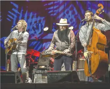  ?? CONTRIBUTE­D PHOTO ?? Sam Bush, Jerry Douglas and Todd Parks play at the Telluride Bluegrass Festival.