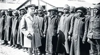  ?? Picture: UNIVERSAL HISTORY ARCHIVE/UIG via GETTY IMAGES ?? HISTORIC IMAGE: General Jan Smuts inspects an SA native labour unit in France. This scene, thought to have been captured by war photograph­er John Warwick Brooke, is one of the few images of Black South Africans involved in the war effort.