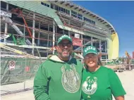  ?? JAMES B. NELSON / MILWAUKEE JOURNAL SENTINEL ?? Allyn and Erin Swan of Milwaukee are first-time Milwaukee Bucks season ticket buyers. They bought a package that includes home games this season and next season.