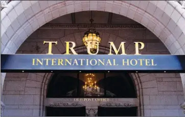  ?? The Associated Press ?? HIGH DOLLAR HOTEL: In this March 11 file photo, the Trump Internatio­nal Hotel is seen in Washington. In the weeks leading up to an invitation-only Republican fundraiser featuring an appearance by President Trump, room rates at the Trump Internatio­nal Hotel in Washington surged to as high as $6,719. That’s more than dozen times the posted price for rooms on other weekends.