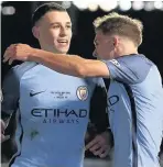  ??  ?? Phil Foden, left, celebrates his equaliser in the first leg against Chelsea