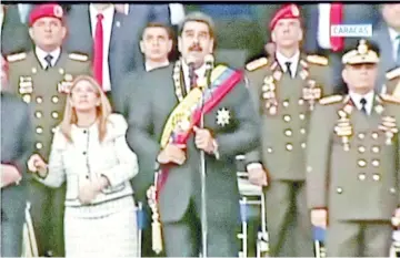  ?? — Reuters photos ?? Maduro reacts during an event which was interrupte­d, in this still frame taken from video.