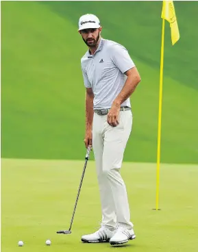  ?? — GETTY IMAGES ?? Dustin Johnson of the United States putts on the 10th hole during a practice round in advance of the Masters tournament at Augusta National Golf Club in Augusta, Ga.