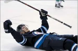  ?? CP PHOTO TREVOR HAGAN ?? Winnipeg Jets’ Nikolaj Ehlers (27) celebrates his goal during second period NHL hockey action against the Vancouver Canucks, in Winnipeg, Monday.