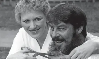  ?? Photo: Bruce Mackenzie ?? HAIRY SITUATION: Winner of the 1985 Beard Growing Competitio­n, Danny Davis, and his wife pose for a celebrator­y photo.