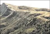  ?? Al Seib Los Angeles Times ?? THE FOOTPRINT of the 2003 Piru fire can be seen atop a ridge in the Lake Piru Recreation Area.