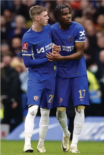  ?? PA ?? Chelsea’s Carney Chukwuemek­a, right, celebrates scoring their third goal with teammate Cole Palmer during the FA Cup quarter-final against Leicester at Stamford Bridge