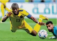  ?? Manu Fernandez/Associated Press ?? Ecuador’s Enner Valencia is fouled by Qatar goalie Saad Alsheeb. Valencia would convert the penalty.