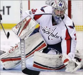  ?? SETH WENIG/The Associated Press ?? Washington Capitals goalie Philipp Grubauer defends the net during the second period of an NHL game against the New York Rangers. Grubauer may be taken by the Vegas Golden Knights in Wednesday’s expansion draft.