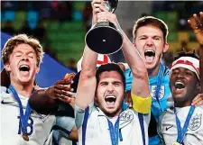  ??  ?? World cup wonders: captain Cook lifts the trophy in Korea last June GETTY IMAGES