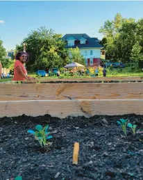  ?? COURTESY ?? Kamora Herrington, KCC founder, stands amid raised garden beds at 75 Sterling Street in Hartford.