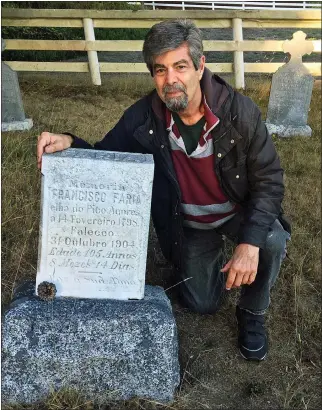  ?? PHOTO BY SCOTT SCHLOTE ?? Steve Jordan at the Hillcrest Cemetery gravesite of Francisco Faria, who was born in 1798and died in 1904.