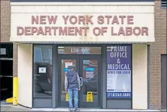  ??  ?? Paycheck pain: A man outside an employment office in NYC, forced closed by COVID-19 amid massive jobs losses in the private economy.