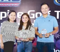  ??  ?? Jobim Carlos (right) and Princess Superal (center) pose with Philippine Golf Tour executive director Narlene Soriano after winning the Order of Merit titles in the PGT and Ladies PGT, respective­ly, during the annual awards rites at The Country Club.