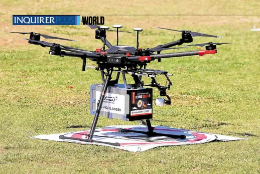  ?? —PHOTOS BY AFP ?? REALLY FAST An unmanned aerial vehicle or drone is ready to deliver fast food from a field in the city of Herzliya on Oct. 11 as it takes part in the National Drone Initiative Test operation. The exercise aims to help develop technology to allow organized drone traffic in the skies.