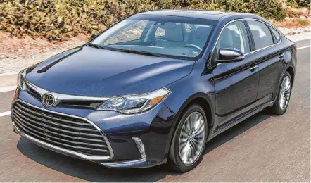  ?? Toyota photos ?? The 2018 Toyota Avalon Limited comes in this hybrid version, which has EPA fuel-economy ratings of 40 mpg city/39 highway/40 combined. This large premium sedan seats up to five people, and has a long list of standard amenities.