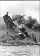 ?? ASSOCIATED PRESS ?? Dec. 7, 1941: The battleship USS Arizona belches smoke as it topples over into the sea during a Japanese surprise attack on Pearl Harbor, Hawaii.
