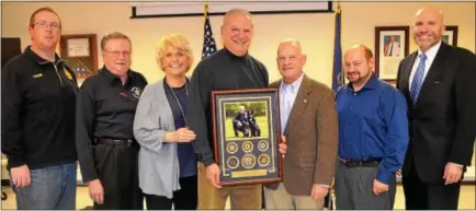  ?? SUBMITTED PHOTO ?? Outgoing Hero Fund president John ‘J.D.’ DiBuonaven­turo, center, holds one of framed commendati­ons he received. With him is Neil Vaughn, from left, Butch Dutter, Carolyn ‘Bunny’ Welsh, James Vito, Robert Kagel and Tom Hogan.