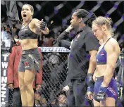  ?? JOHN LOCHER / ASSOCIATED PRESS ?? Amanda Nunes (left) celebrates Friday’s win over Ronda Rousey after the Las Vegas bout was stopped. “Forget about her,” Nunes told fans.