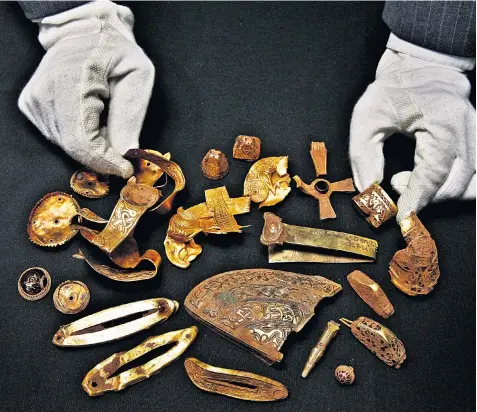  ??  ?? Part of a hoard of Anglo-Saxon gold found in Staffordsh­ire