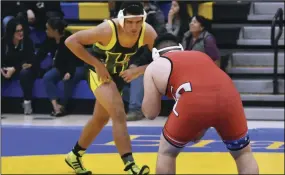  ?? PHOTO AARON BODUS ?? Holtville’s Edward Rubin bears down on Imperial’s Ethan Zavala in the IVL 222-pound championsh­ip match on Wednesday in Brawley. Rubin would pin Zavala in 1:54 to grab the gold.