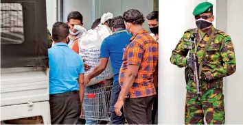  ??  ?? On Friday, officials from the Government Analyst’s Department moved hundreds of kilograms of heroin from the sealed PNB production room and transporte­d them under STF guard to their department.
Pic by Sameera Weeraseker­a