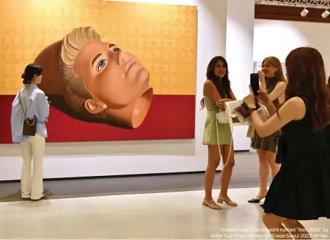  ?? ?? Visitors look at an artwork named "Ken, 2023" by artist Sun Yitian during the Frieze Seoul 2023 art fair.