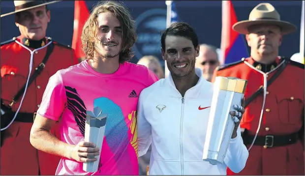  ?? — GETTY IMAGES ?? Rafael Nadal (right) and Stefanos Tsitsipas pose with their trophies following the men’s final at the Rogers Cup yesterday.