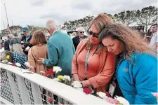  ?? JOE BURBANK TRIBUNE NEWS SERVICE ?? Space Shuttle Columbia team members remember the loss of the STS-107 crew during NASA’s Day of Remembranc­e ceremony at Kennedy Space Center Visitor Complex Thursday.