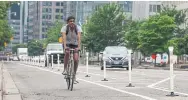  ?? RICK MADONIK TORONTO STAR FILE PHOTO ?? A man rides in the bike lanes on University Avenue. Reader Mike Faye says he often sees skilled riders refuse to slow down and put their pleasure ahead of the safety of others.