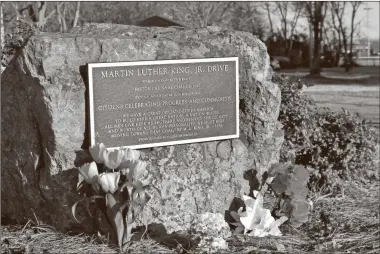  ?? Blake silvers, File ?? At the corner of Court Street and Martin Luther King Jr. Drive in Calhoun sits a monument commemorat­ing the latter’s name change in 1982. Monday, members of the community, in lieu of a gathering due to COVID concerns, are encouraged to stop by and pay their respects and remember the civil rights icon.
One of the most well-known moments in civil rights history, the March on Washington was a nationwide outcry from Black Americans who marched to stop racial discrimina­tion and police brutality and gain job equality. The emotional event is where Martin Luther King Jr. gave his famous “I Have a Dream’’ speech. Pictured: Martin Luther King Jr. addresses the crowd on the steps of the Lincoln Memorial during the historic March on Washington.