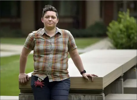  ?? PHOTOS BY CLIFF GRASSMICK — STAFF PHOTOGRAPH­ER ?? University of Colorado Boulder graduate student Elsa Culler is pictured outside her office earlier in the school year.