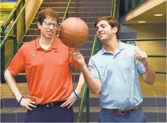  ?? BARBARA HADDOCK TAYLOR/BALTIMORE SUN ?? Brett Greenberg, left, and Ben Eidelberg are graduates of McDonogh School who now work for the Washington Wizards basketball organizati­on.